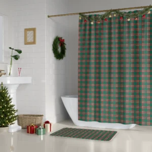 Forest green windowpane Christmas shower curtain beside a white tub, with a wreath and a small lit tree
