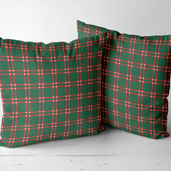 Two forest green windowpane throw pillows next to each other