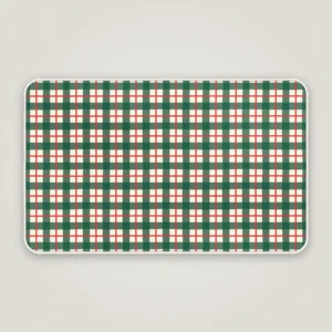 Green check Christmas bath mat with a white bound edge, seen from above