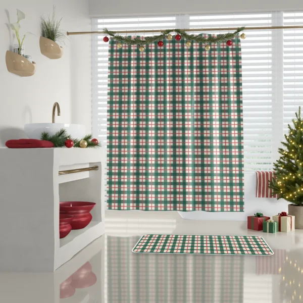 Green check shower curtain in a white bathroom with red towels on a shelf and a decorated tree