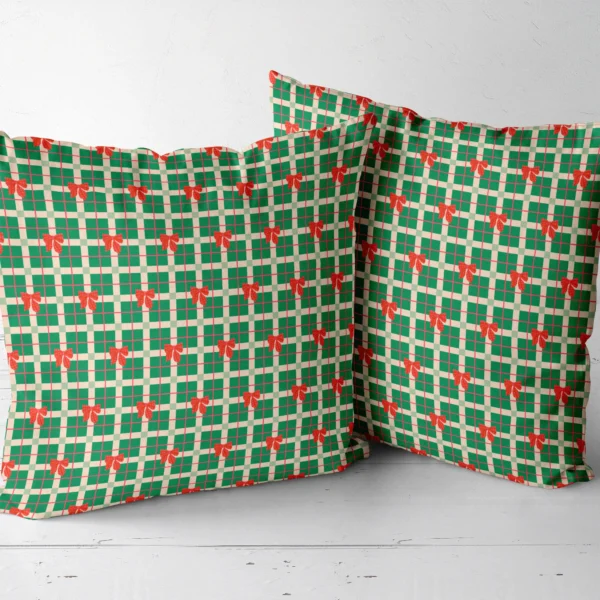 Two green plaid bow throw pillows side by side