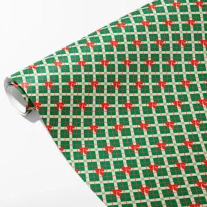 Roll of green and cream plaid wrapping paper with red plaid bows in rows, partly unrolled on white