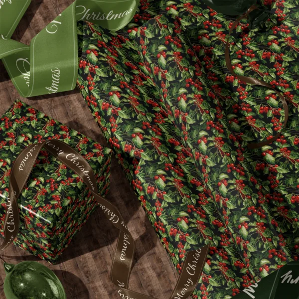 A sheet of black holly berry gift wrap and a wrapped box with satin ribbons on a wooden floor