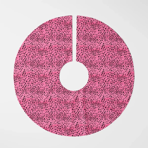 Hot pink spotted tree skirt laid flat, top view on white, black spots swirling over pink