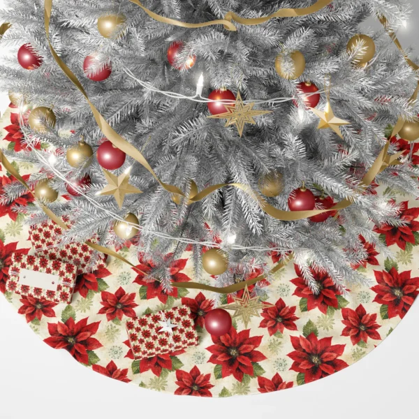Lit tree with gifts arranged on the red and cream poinsettia skirt