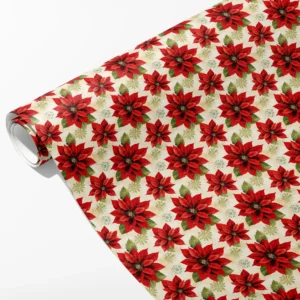 Roll of cream wrapping paper with large red poinsettias, sage leaves and pale starbursts, partly unrolled on white