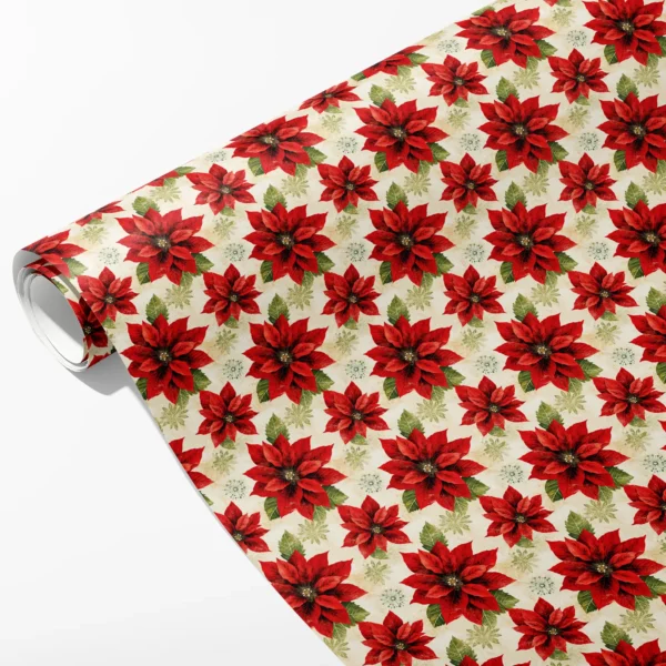 Roll of cream wrapping paper with large red poinsettias, sage leaves and pale starbursts, partly unrolled on white