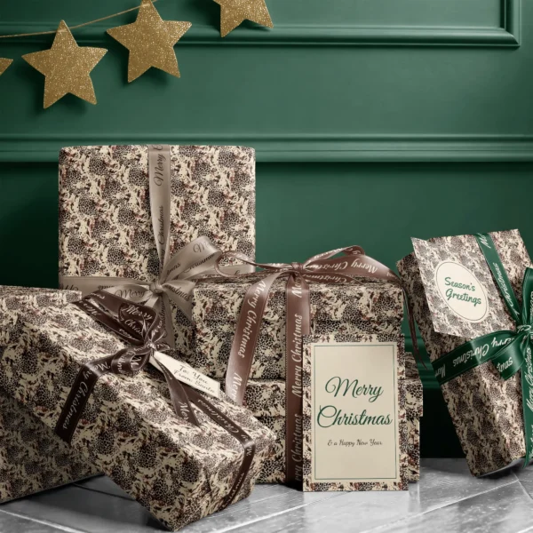 Stack of presents in brown leopard paper with ribbons and a Merry Christmas card by a dark green wall