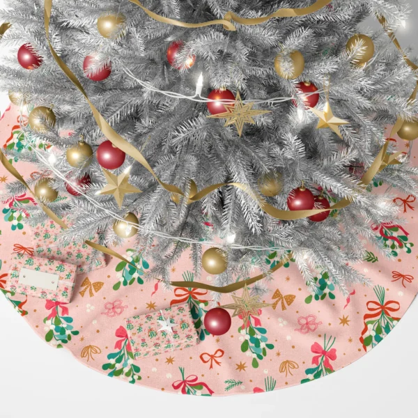 Pink mistletoe tree skirt under a lit Christmas tree with gifts