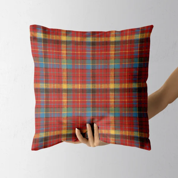 Hand holding the four-color flannel plaid throw pillow