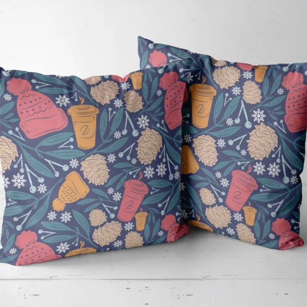 Two navy cozy winter throw pillows next to each other