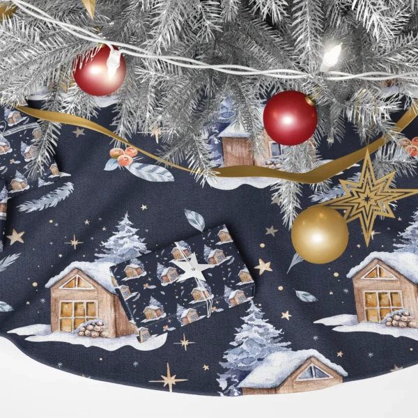 Close-up of the navy skirt under a silver tree: snowy cabins with glowing windows, gold stars and a wrapped gift