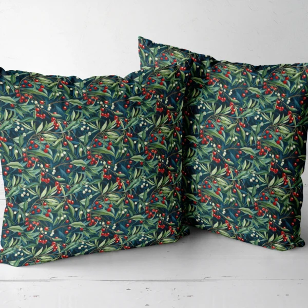 Two navy winter berry throw pillows next to each other