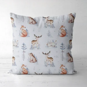 Pale blue woodland animal pillow on a white floor, front view