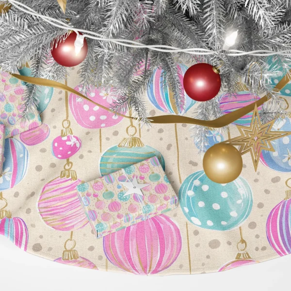 Detail of pink, mint and lilac baubles hanging from gold threads on cream