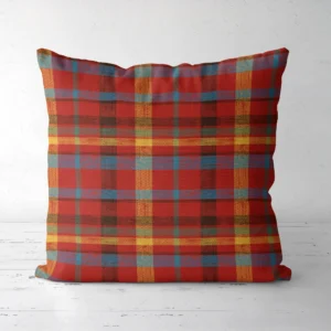 Patchwork plaid Christmas pillow, front view, uneven mustard and denim bands on red