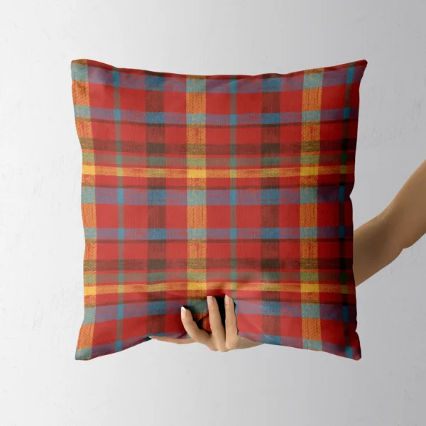 Hand holding the quilt-look patchwork throw pillow
