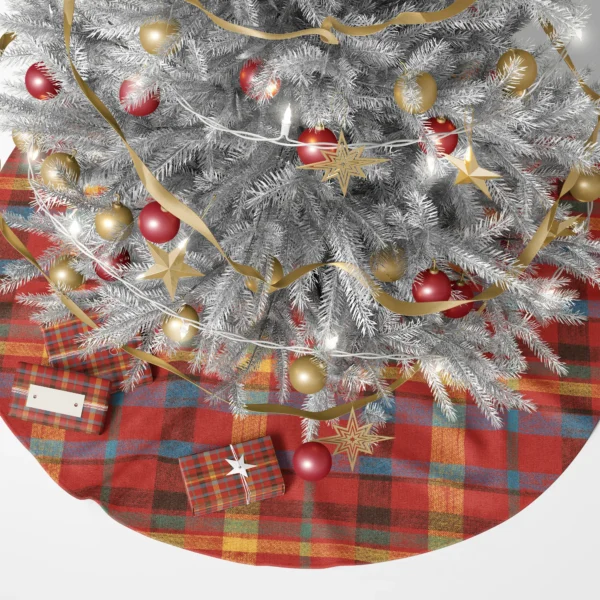 Quilt-look plaid tree skirt under a lit Christmas tree with wrapped gifts