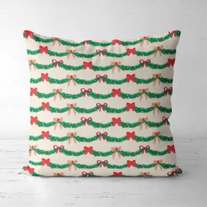 Pine garland Christmas pillow, front view, on a white floor
