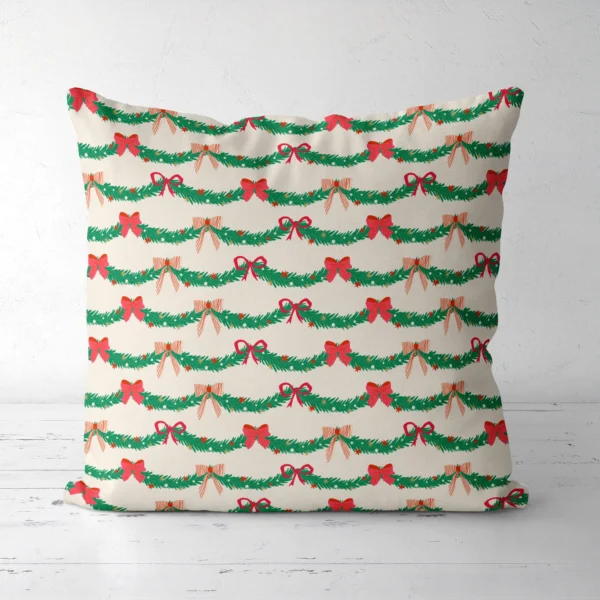 Pine garland Christmas pillow, front view, on a white floor