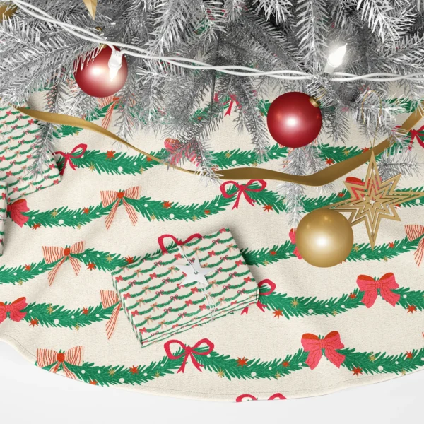 Close-up of looping pine swags with cherry bows and red-striped bows on cream