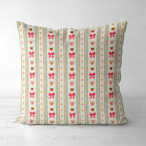 Pink bow stripe Christmas pillow, front view, standing on a white floor