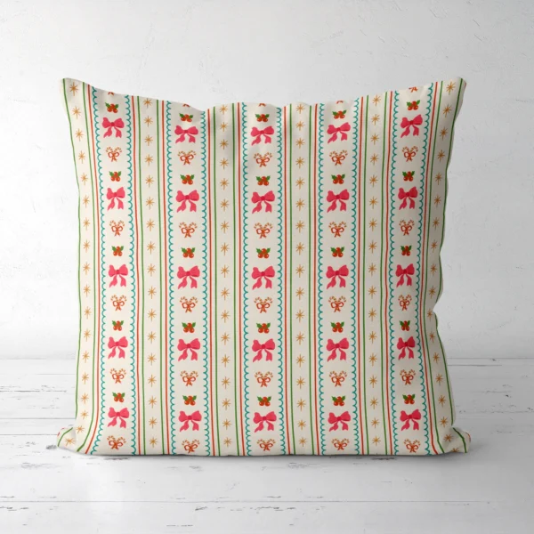 Pink bow stripe Christmas pillow, front view, standing on a white floor