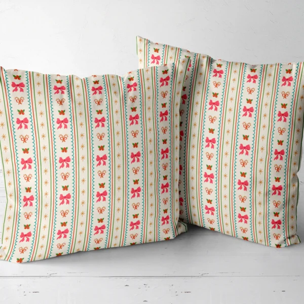 Two pink bow stripe throw pillows side by side