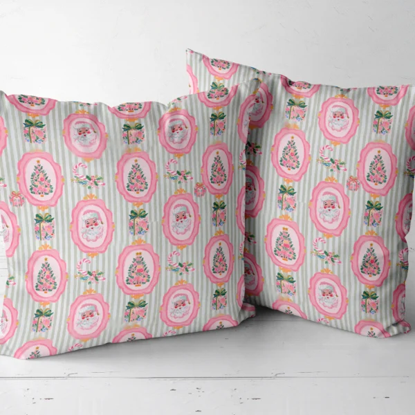 Pair of pink Santa throw pillows next to each other