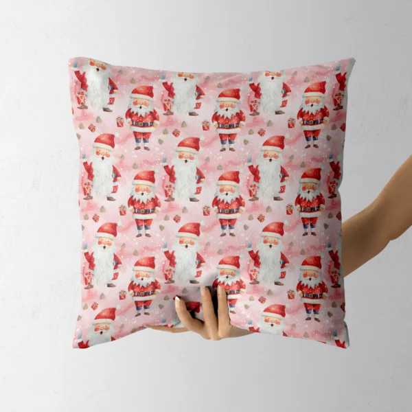 Hand gripping the blush pink Santa throw pillow