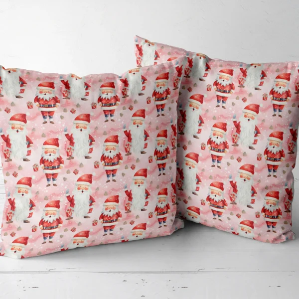 Two pink Santa Christmas pillows shown together