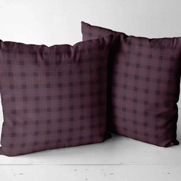 Two plum and black plaid throw pillows side by side