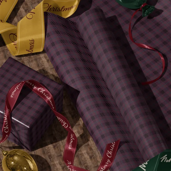 Rolls of plum and black plaid gift wrap and a wrapped box with satin ribbons on a wooden floor