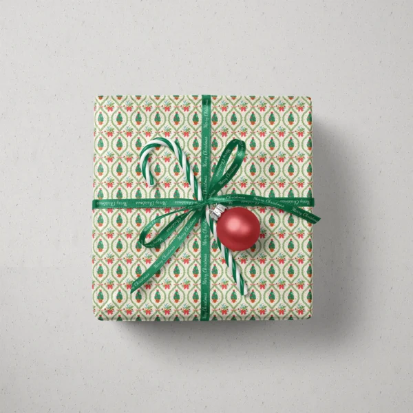Top view of a gift in potted tree lattice paper with a ribbon, candy canes and a bauble