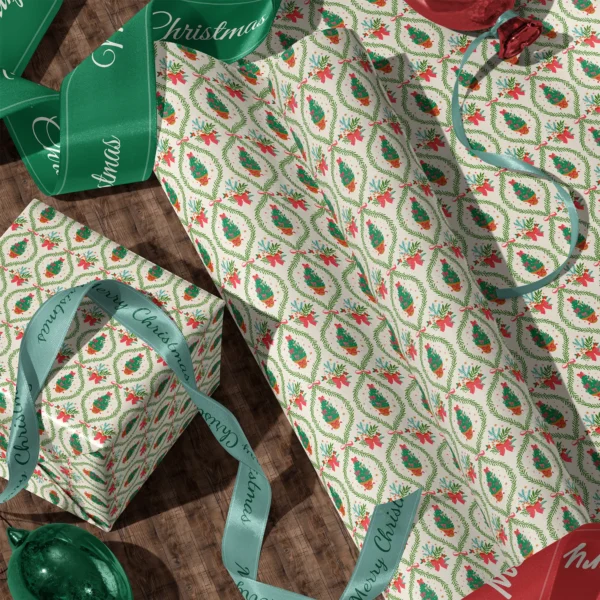 Rolls of potted tree lattice gift wrap and a wrapped box with satin ribbons on a wooden floor