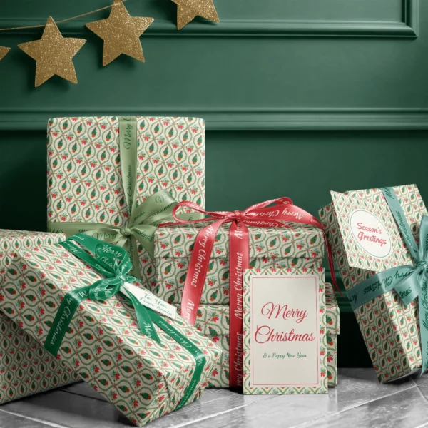 Stack of presents in potted tree lattice paper with ribbons and a Merry Christmas card by a dark green wall