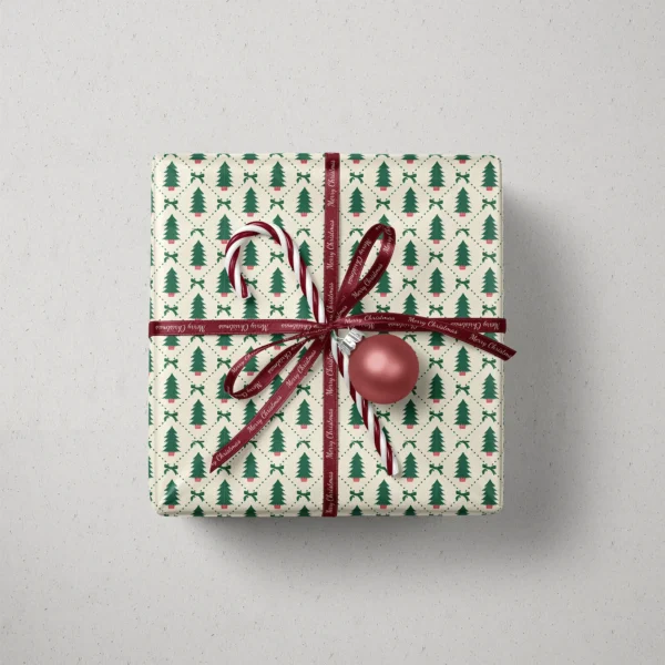Top view of a gift in potted tree diamond paper with a ribbon, candy canes and a bauble