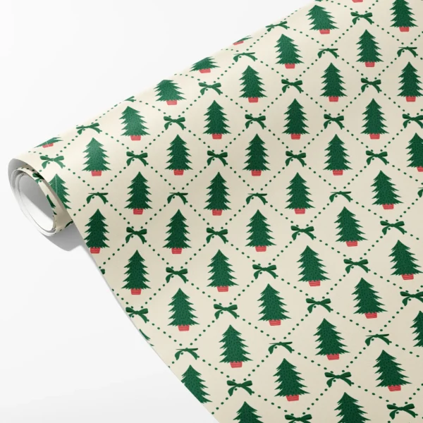 Roll of cream wrapping paper with green potted trees in a dotted green diamond lattice with small bows, partly unrolled