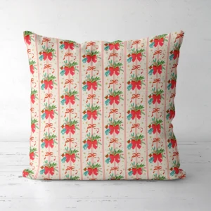 Red bow bouquet Christmas pillow facing forward on a white floor