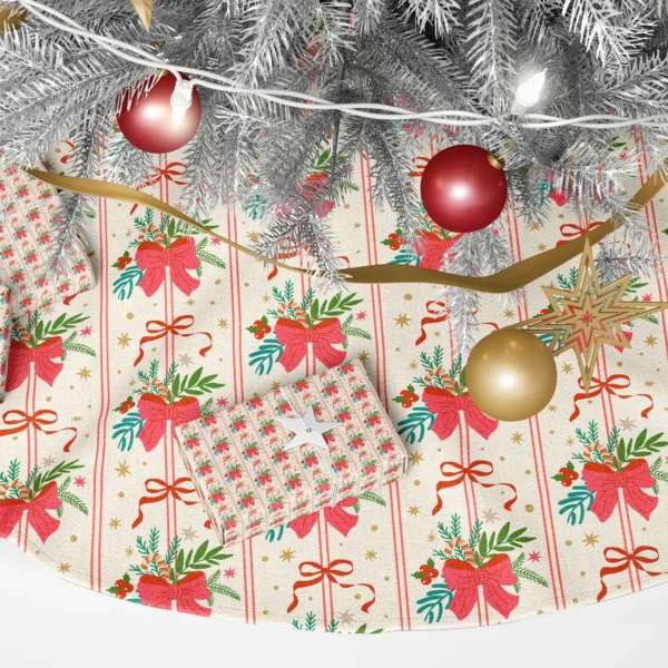 Close-up of a cherry-red bow gathering pine, teal fir, berries and a candy stick