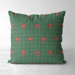 Red bow gingham Christmas pillow, front view, red bows on green and cream check