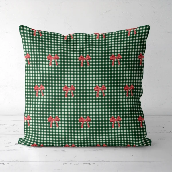 Red bow gingham Christmas pillow, front view, red bows on green and cream check