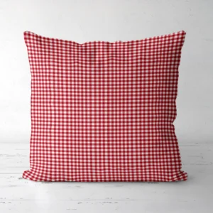 Red gingham throw pillow, front view, on a white floor