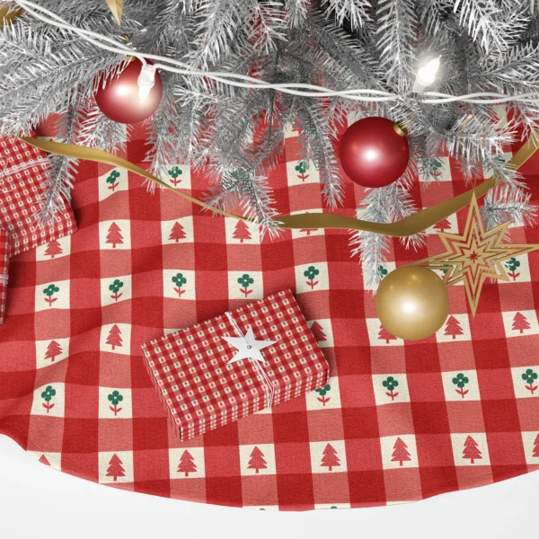 Close-up of miniature red trees and green flowers inside cream squares of the check