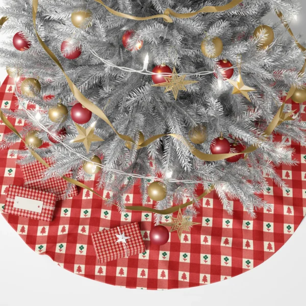 Red check tree skirt with tiny trees beneath a lit Christmas tree and wrapped gifts