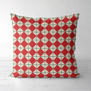 Red harlequin Christmas pillow, front view, diamonds on cream