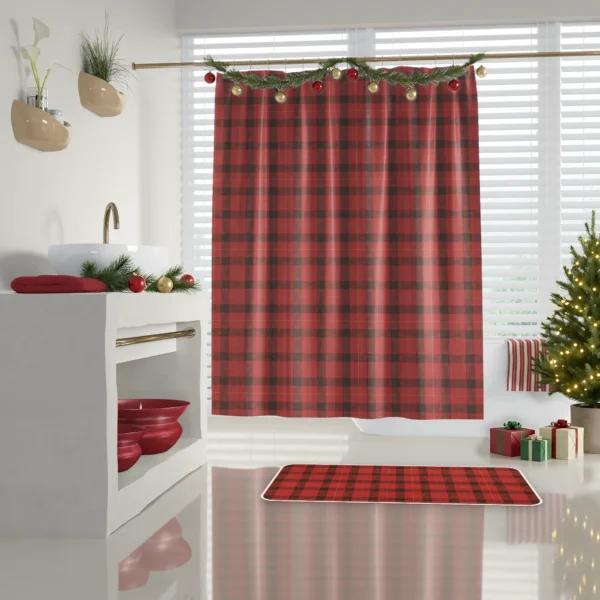 Red lumberjack check bath mat on a glossy floor below the matching Christmas shower curtain