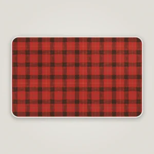 Red lumberjack check Christmas bath mat with a white bound edge, seen from above