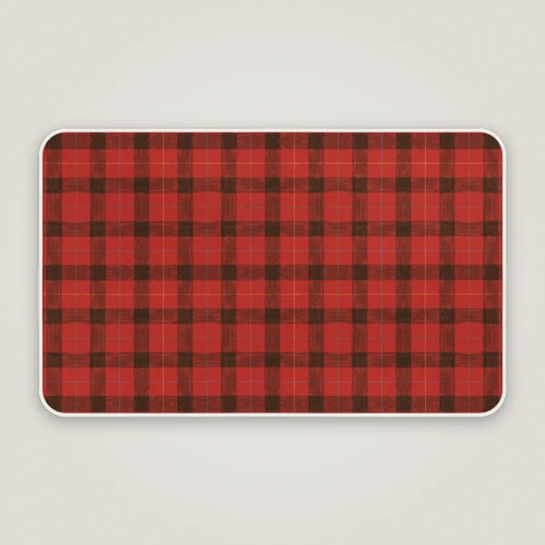 Red lumberjack check Christmas bath mat with a white bound edge, seen from above