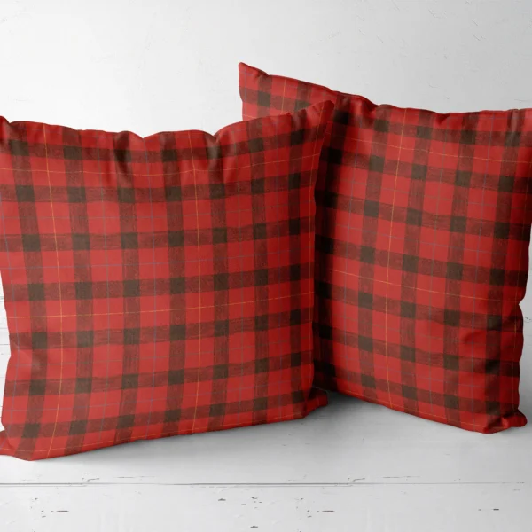Two red lumberjack check throw pillows side by side